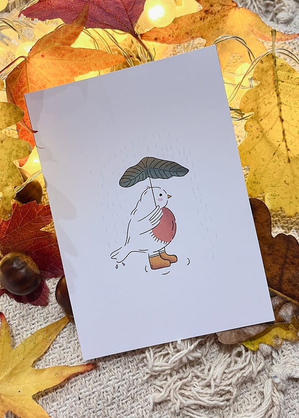 Photo d'une illustration représentant un oiseau sous la pluie avec un parapluie